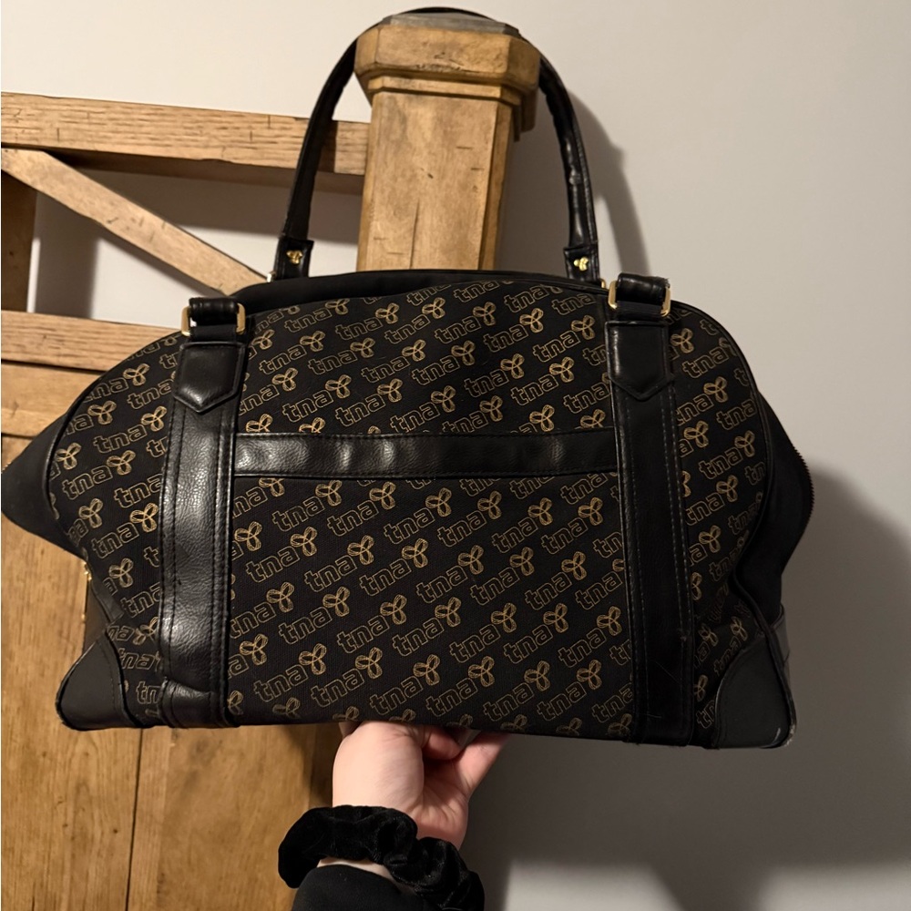Vintage TNA Black and Gold Logo Duffel Bag